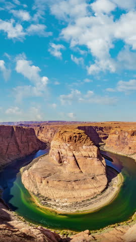 
Beautiful time lapse of Horseshoe Bend on the Colorado river on a sunny day. The most iconic tourist attraction of the Grand Canyon in Page, Arizona, USA.