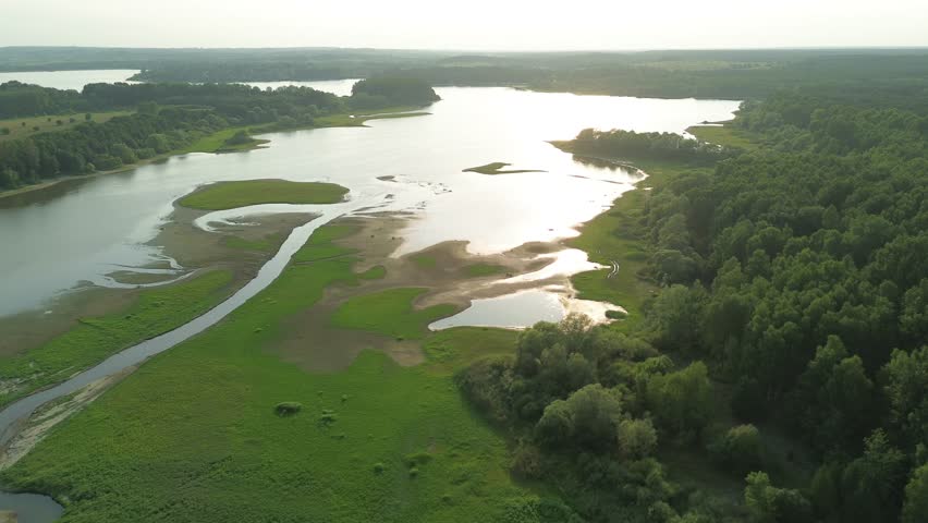 Wilderness landscape with meadow and water levels