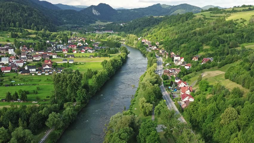 Aerial view of houses near river bend