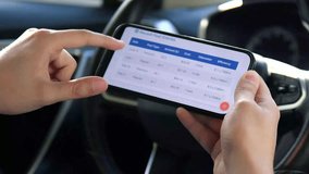 A driver's hands use a fuel cost tracking application on a phone, scrolling through detailed expense graphs and data. This clip is perfect for content about budgeting, car ownership, and personal - Powered by Shutterstock - Get 15% off with code: PIKWIZARD15