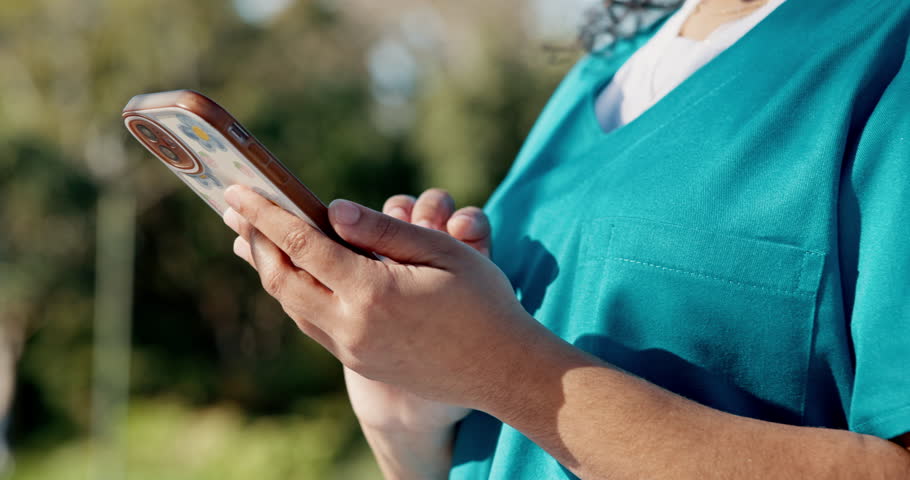 Nurse, hands and typing with phone for medical study, telehealth app or research at outdoor park. Closeup, female person or scrolling with mobile smartphone for UX, communication or news in nature