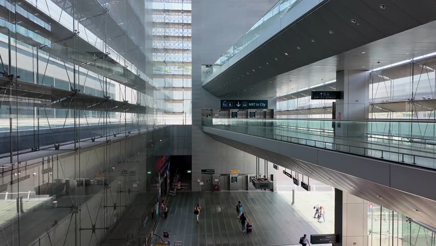 SINGAPORE, SINGAPORE - 27th SEPTEMBER 2024: POV shot descending escalator into the MRT station at Changi Airport in Singapore,