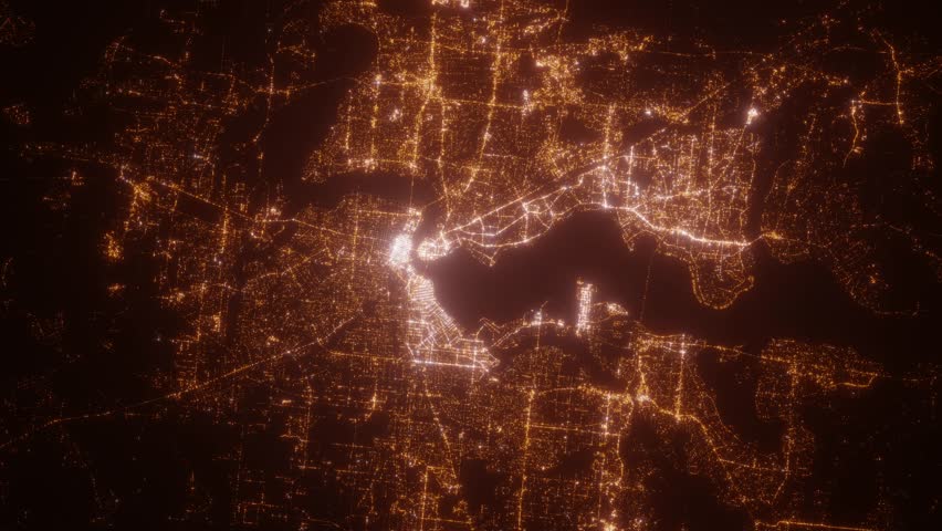 Jacksonville (Florida, USA) aerial view at night. Top view on modern city with street lights. Camera is zooming out, rotating clockwise. Vertical video. The north is on the left side