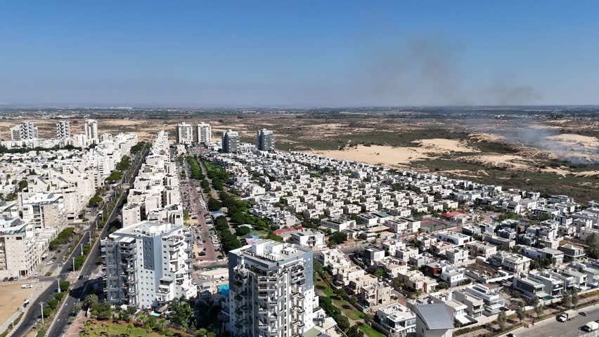 Aerial 4K drone footage of southern Ashdod, capturing residential streets, buildings, and urban layout from above.