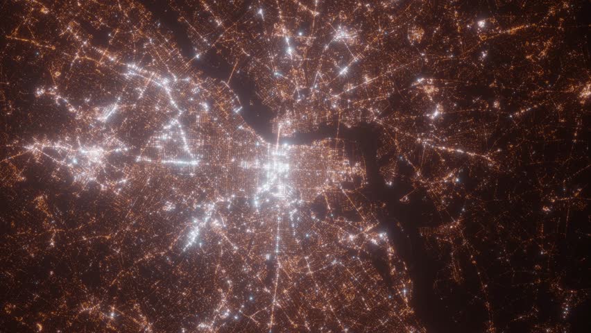 Philadelphia (Pennsylvania, USA) aerial view at night. Top view on modern city with street lights. Camera is zooming out, rotating counterclockwise. Vertical video. The north is on the left side