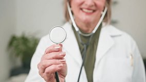 Smiling Female Doctor Offers Professional Medical Consultation with Stethoscope in a Diverse Healthcare Setting - Powered by Shutterstock - Get 15% off with code: PIKWIZARD15