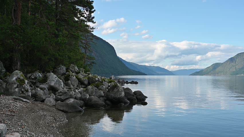 Peaceful landscape of Lake Teletskoye in Altay, Russia. Beautiful summer nature landscape at during daytime
