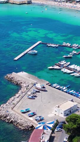 Stunning Aerial View of Boats at Dock in a Vibrant Harbor Surrounded by Crystal-Clear Water