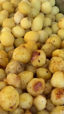 in the buffet round young potatoes part fried pick up on a plate