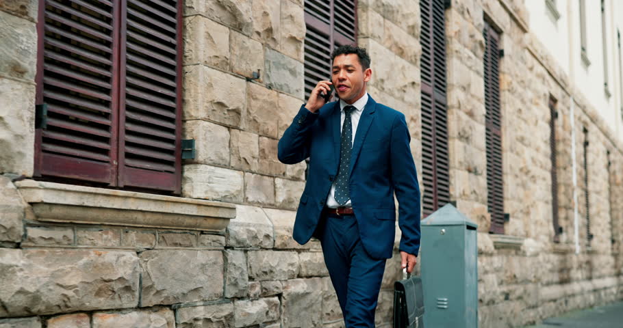 Phone call, business man and walking in city for travel, property negotiation or offer. Mobile, real estate agent and communication outdoor for commute, development opportunity and talk to contact