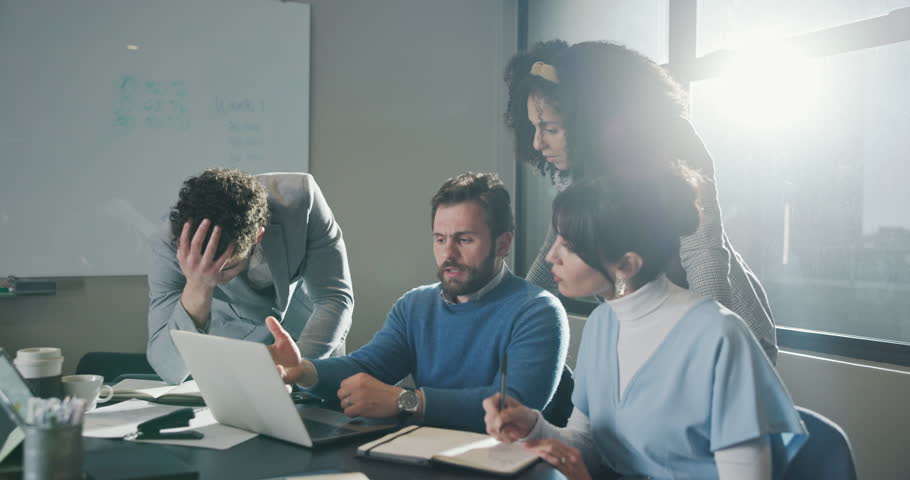 Business stress, group or laptop in meeting with submission fail, missed deadline or disappointed. Editor team, people and tech with concern for article criticism, headline mistake or flare at agency