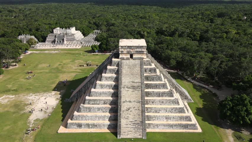 Aerial footage captures the Mayan pyramids of Mexico, showcasing ancient architecture, lush surroundings, and the grandeur of this historic civilizati