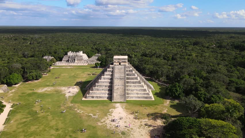 Aerial footage captures the Mayan pyramids of Mexico, showcasing ancient architecture, lush surroundings, and the grandeur of this historic civilizati