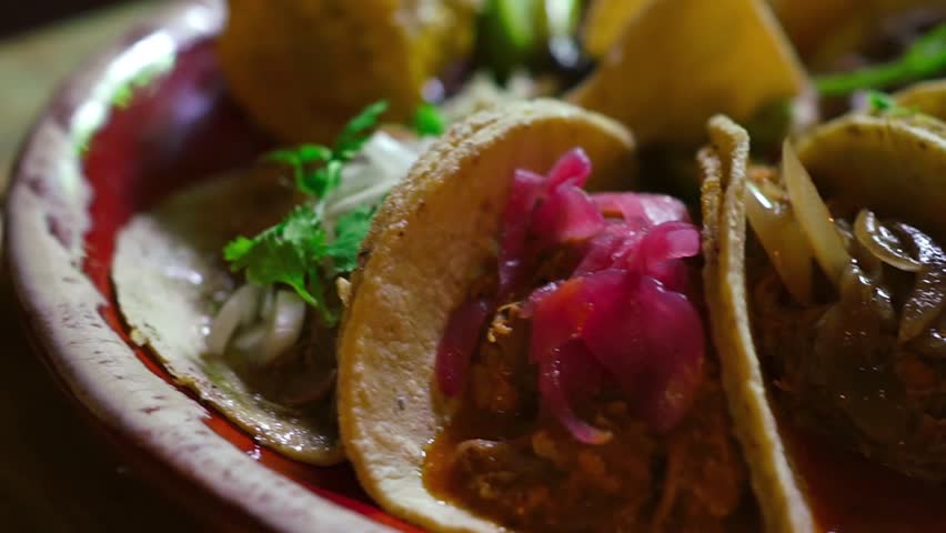 A variety of delicious traditional Mexican tacos on a plate