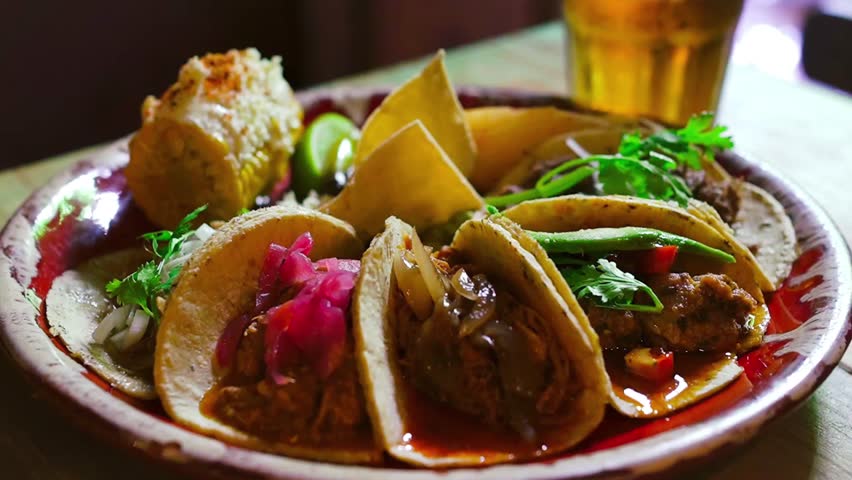 A variety of delicious traditional Mexican tacos on a plate