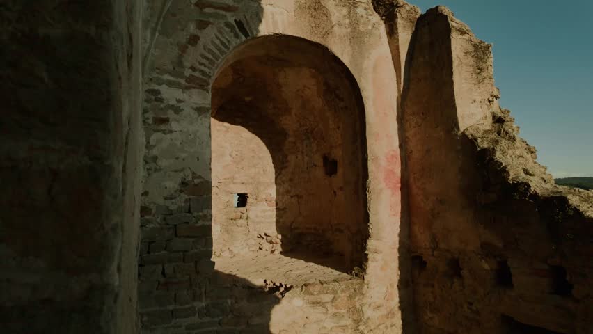 Scenic view from the medieval castle wall in Dürnstein, Austria, overlooking the Danube River and surrounding green hills. Historic and picturesque European landscape.