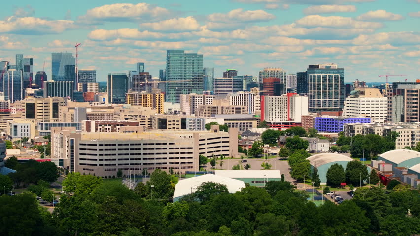 Downtown district of Nashville city in Tennessee, USA. Urban landscape of high-rise buildings in developing American metropolitan area.