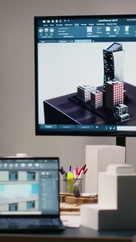 Vertical Video Clean empty workspace of a real estate architecture firm with planning documents, structural designs and digital tools used for urban development and residential project execution.