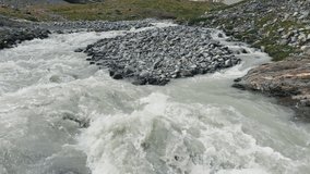 Alpine river rapids with rocks and fast water flow - Powered by Shutterstock - Get 15% off with code: PIKWIZARD15