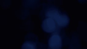 Glowing bokeh particles and abstract luminous shapes move gracefully across a radiant colorful background, forming an entrancing visual flow perfect for modern digital design and ambient motion effect - Powered by Shutterstock - Get 15% off with code: PIKWIZARD15