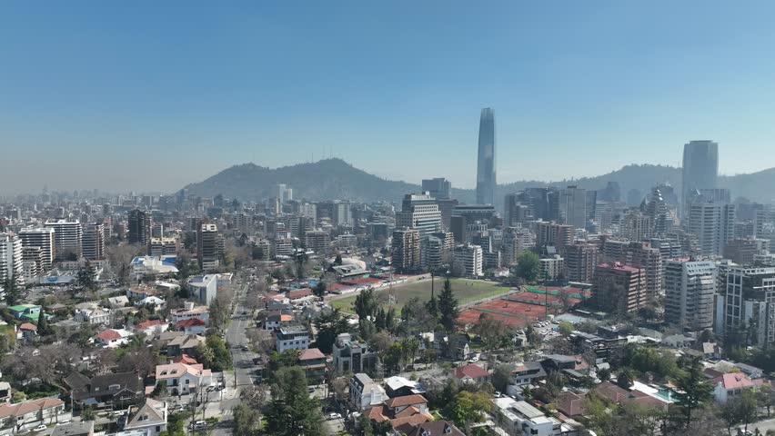 Santiago city in Chile. Aerial view of the skyline of buildings and snowy mountain.