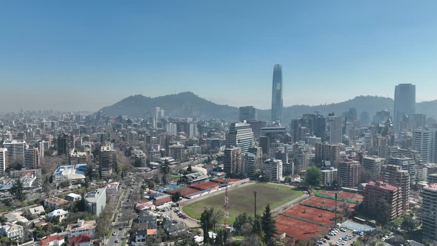 Santiago city in Chile. Aerial view of the skyline of buildings and snowy mountain.