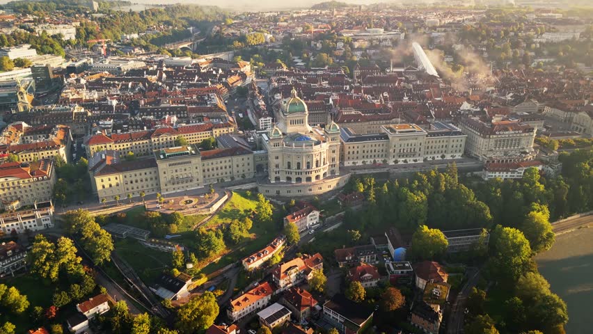 Bundeshaus Bern in Switzerland during a little cloudy sunrise.