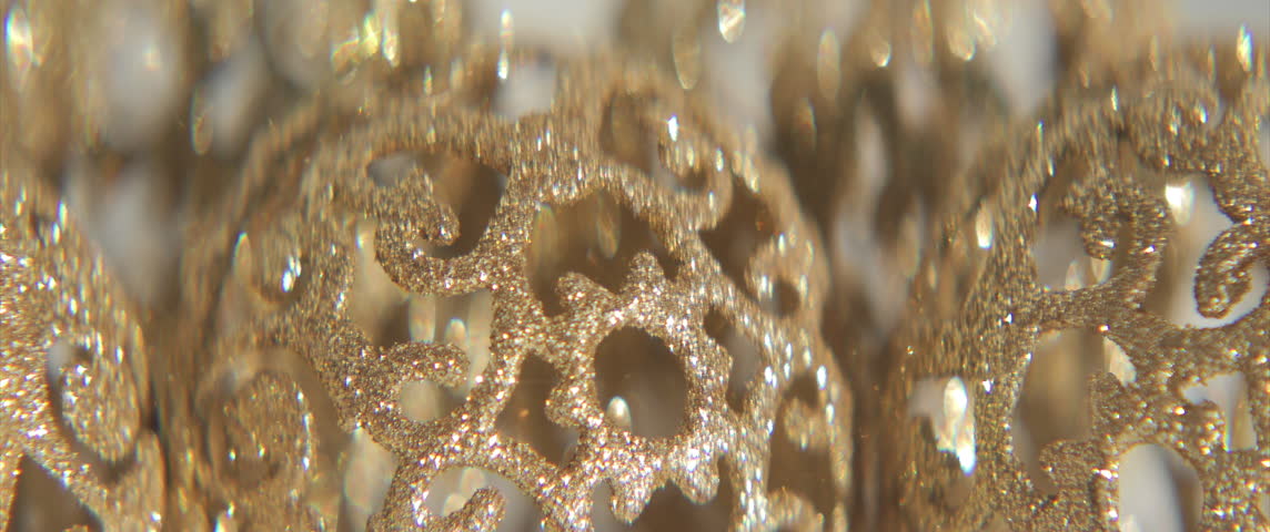 Detailed sequined Christmas balls sliding 4K scope video