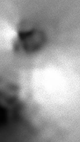 Hazy spots and atmospheric features on titan, suitable for science publications, astronomy websites, and educational resources about saturns moon.