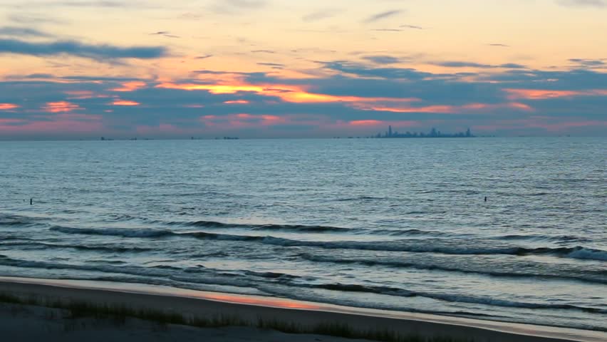 Sunset over Lake Michigan with Chicago skyline seen from Indiana Dunes National Park, USA