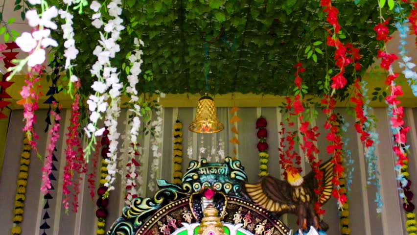 Beautiful Ganpati idol in decorated pandal for Ganesh Chaturthi celebration. Perfect for festival, culture and devotional stock footage needs.