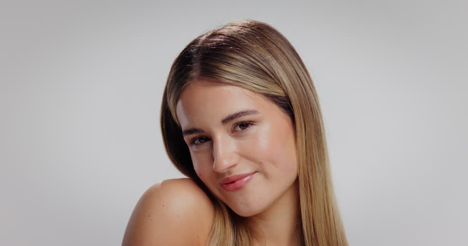 Makeup, manicure and face of woman in studio with self care, cosmetics and facial glow. Happy, beauty and portrait of female person from London with cosmetology and nails by white background.