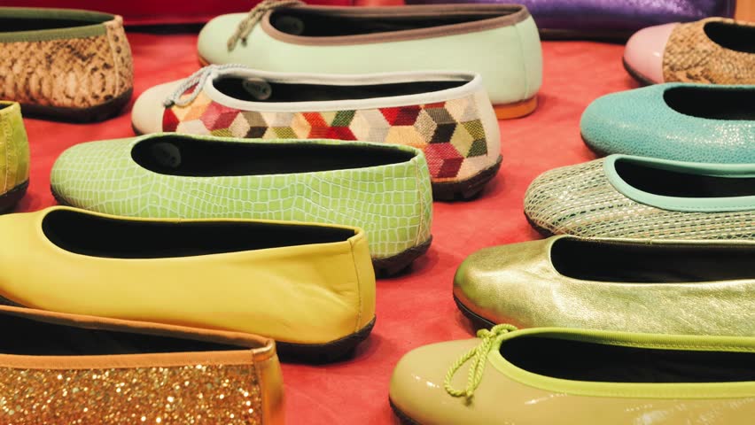 A counter with a large number of colorful ballet shoes. High quality 4k footage