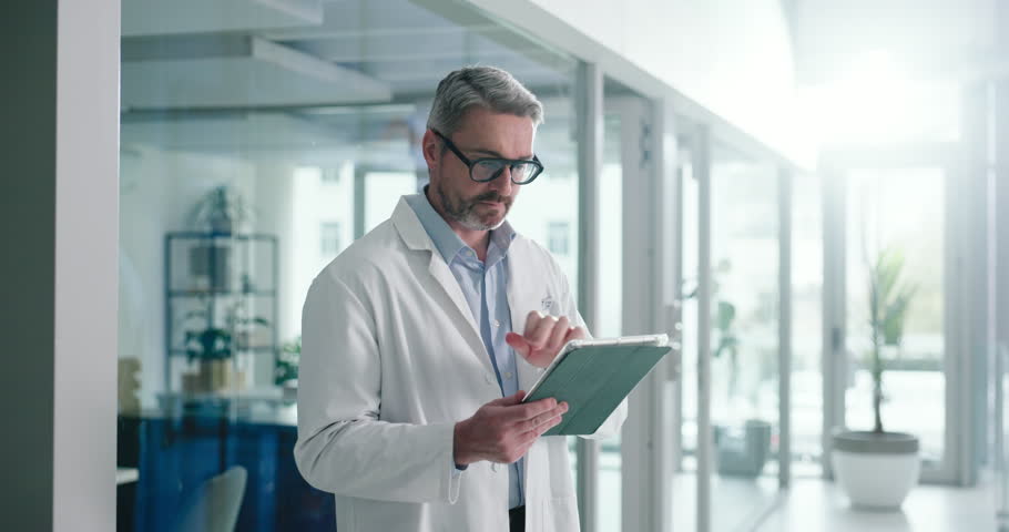 Reading, thinking and tablet with doctor in hospital for cancer biopsy review, healthcare history and test results. Medical case diagnostic, treatment plan and reflection with mature man in clinic