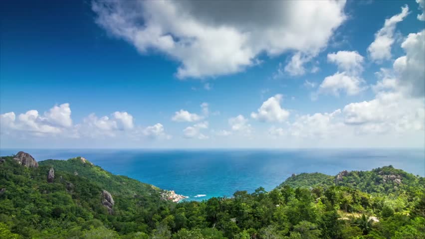 Serene Tropical Island Seascape Lush Green Hills Blue Ocean Sky White Clouds Sunny Day Vacation Paradise Scenic View Breathtaking Nature