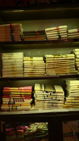 Kerala kasavu mundu and sarees from Balaramapuram, featuring ivory-white cotton with golden zari borders, traditionally worn during Onam, Vishu, and weddings, cultural heritage and festive grace. 
