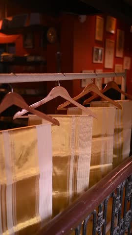 Kerala kasavu mundu and sarees from Balaramapuram, featuring ivory-white cotton with golden zari borders, traditionally worn during Onam, Vishu, and weddings, cultural heritage and festive grace. 
