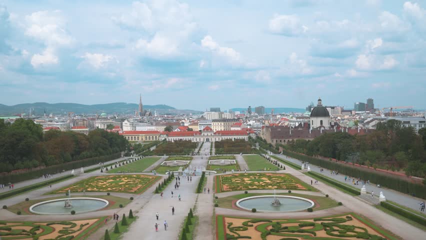Elevated view from the Upper Belvedere overlooking the ornate gardens and the Lower Belvedere Palace and in Vienna, Austria in the distance
