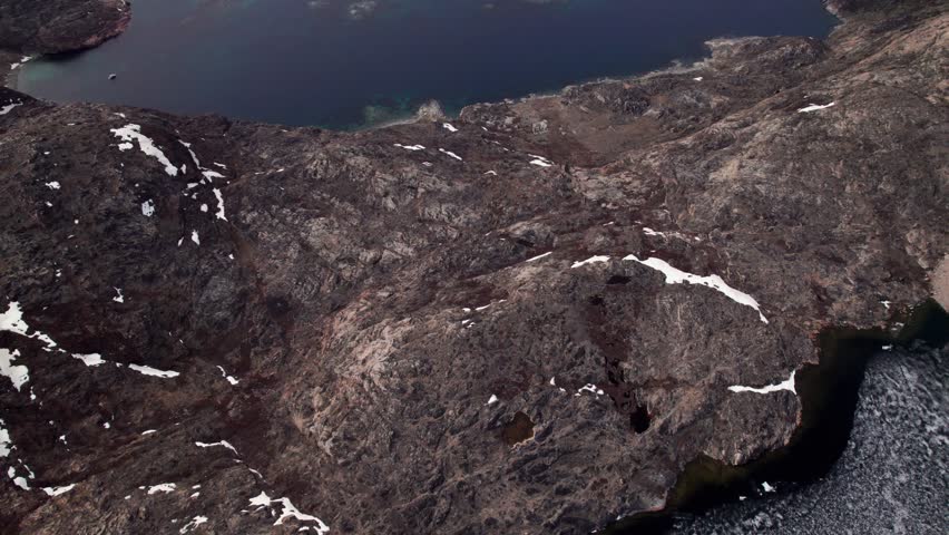 Soar over the vast, ice-free waters of Uummannaq Fjord. Witness the breathtaking scale of Greenland