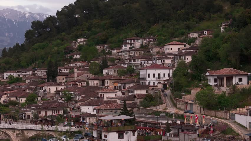Charming hillside townscape in Berat, Albania under cloudy skies
