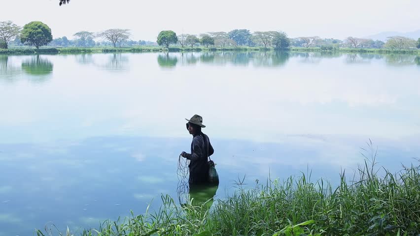 Fisherman checking the conditions around the lake on the daylight