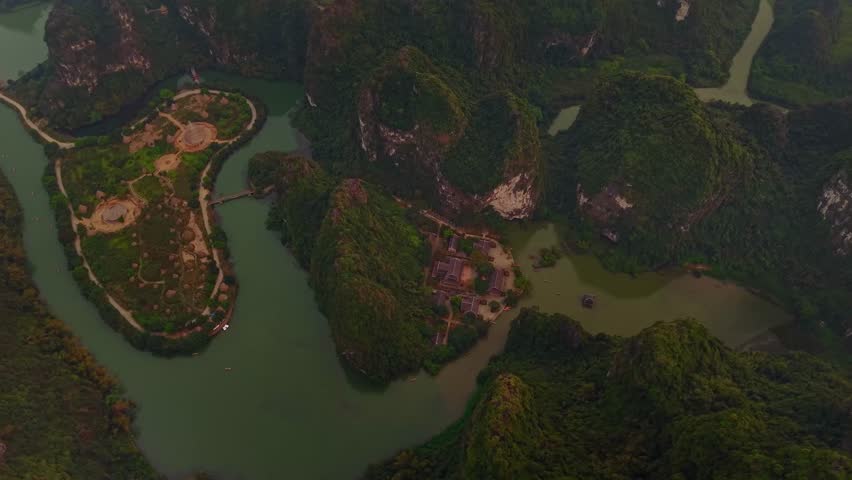 Scenic aerial view of Ninh Binh river valley and lush green landscape in Vietnam.