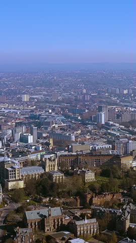 Vertical 4K drone video of Bristol city centre and Clifton skyline, featuring Wills Memorial Building and parks - mobile first aerial ideal for travel, real estate and destination branding.