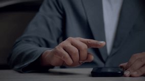 Businessman analyzing business data using mobile phone with futuristic dashboard UI, interactive charts, and real-time performance metrics. - Powered by Shutterstock - Get 15% off with code: PIKWIZARD15