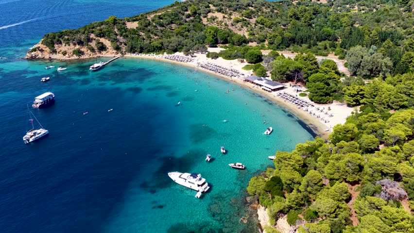 Aerial view of the popular beach at Tsougrias island, Skiathos, Sporades, Greece, excursion spot for tourists and cruises