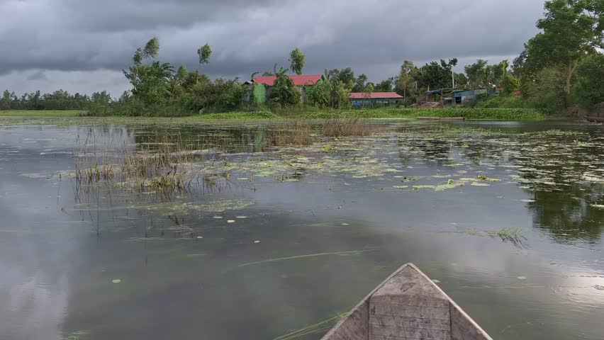 BEUTIFUL VILLAGE RIVER SEEN FROM BOATS 