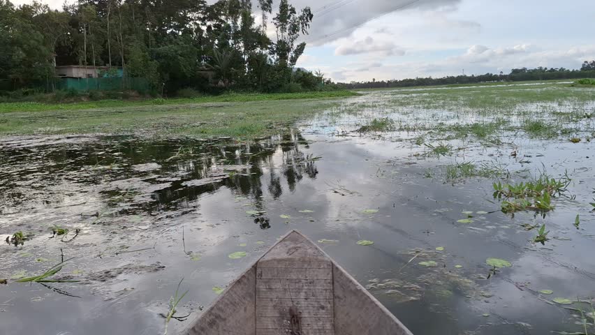 BEUTIFUL VILLAGE RIVER SEEN FROM BOATS 