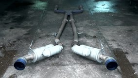 The exhaust system lies on the floor of the auto repair shop. Car muffler. - Powered by Shutterstock - Get 15% off with code: PIKWIZARD15