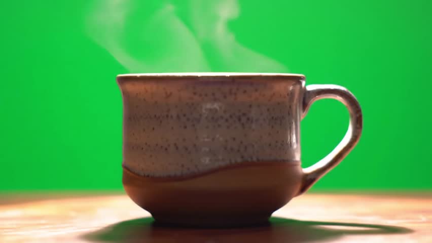 Steaming Ceramic Mug on Wooden Table with Green Background - Powered by Shutterstock - Get 15% off with code: PIKWIZARD15
