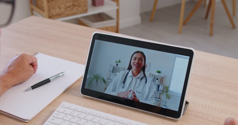 Senior patient using tablet for online consultation with female doctor. Woman speaking, explaining diagnosis after hospital checkup, prescription and treatment via telemedicine mobile app on screen